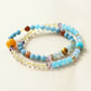 Natural Aquamarine, Blue Chalcedony, Fluorite, Citrine, Amazonite, Golden Tiger Eye, Yellow Garden Quartz, Rutilated Quartz, and Calcite AI Companion Bracelet with NFC crystal centerpiece.