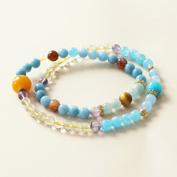 Natural Aquamarine, Blue Chalcedony, Fluorite, Citrine, Amazonite, Golden Tiger Eye, Yellow Garden Quartz, Rutilated Quartz, and Calcite AI Companion Bracelet with NFC crystal centerpiece.