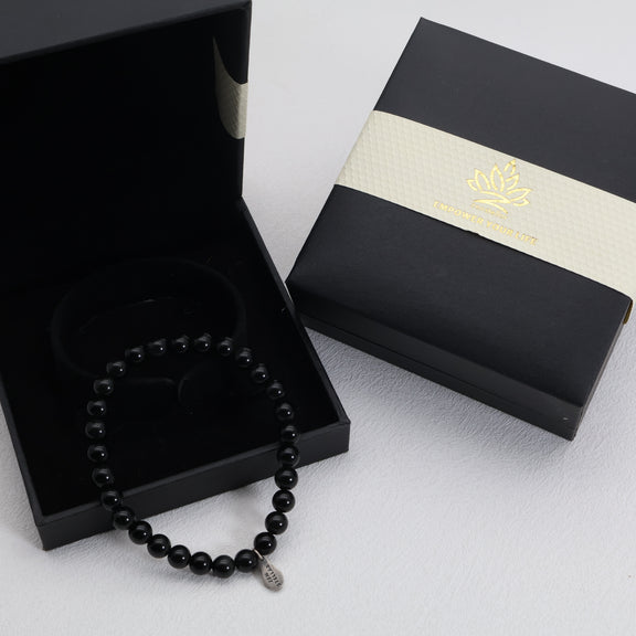 lack obsidian crystal bracelet worn on the wrist for a sleek everyday look