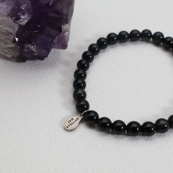 Black obsidian bracelet with 6mm beads shown for size reference
