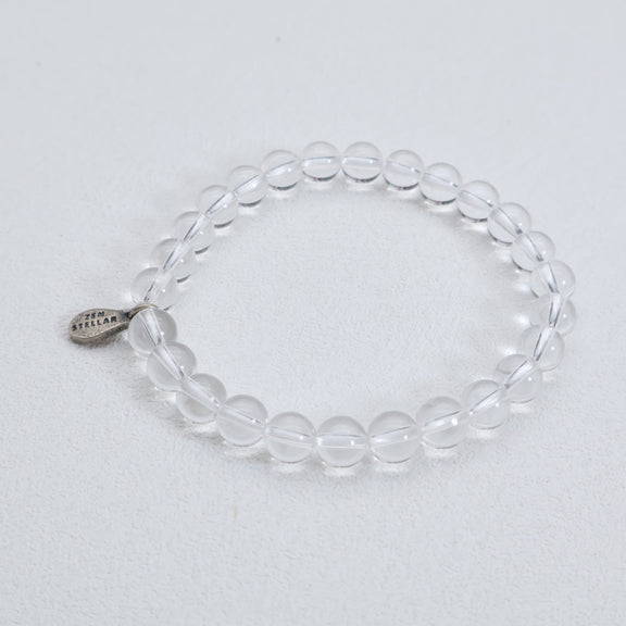 Detail of the 925 sterling silver charm on a clear quartz bead bracelet