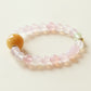 Dew Petal Ease Crystal Bracelet featuring 8mm Pink Agate beads and Prehnite accent stone displayed on clean background highlighting gemstone texture and softness