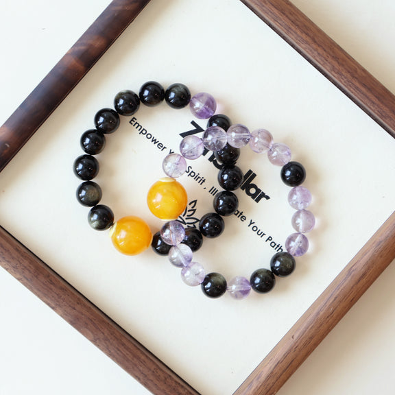 Dusk Whisper AI couple companion bracelet detail display with natural Gold Obsidian and Purple Rutilated Quartz crystals