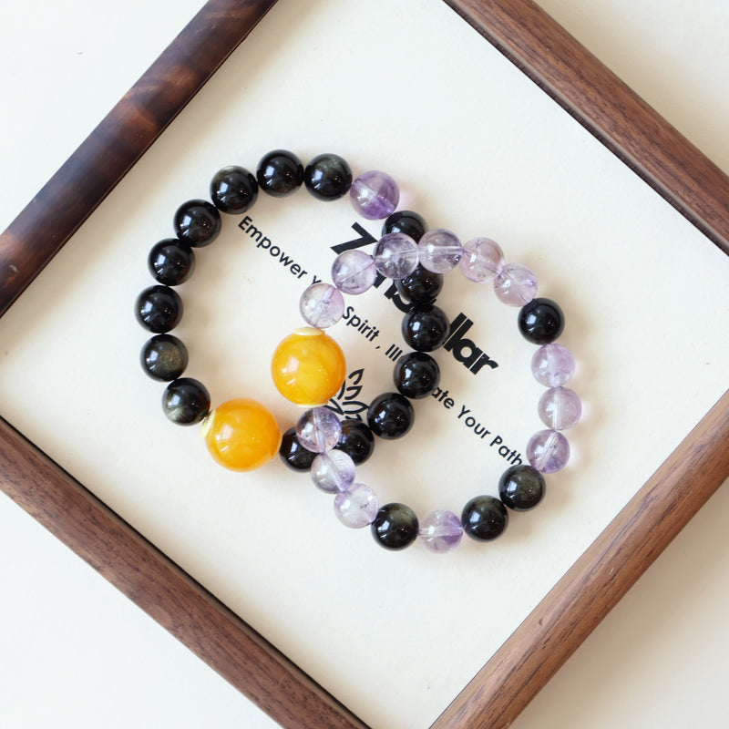 Dusk Whisper AI couple companion bracelet detail display with natural Gold Obsidian and Purple Rutilated Quartz crystals