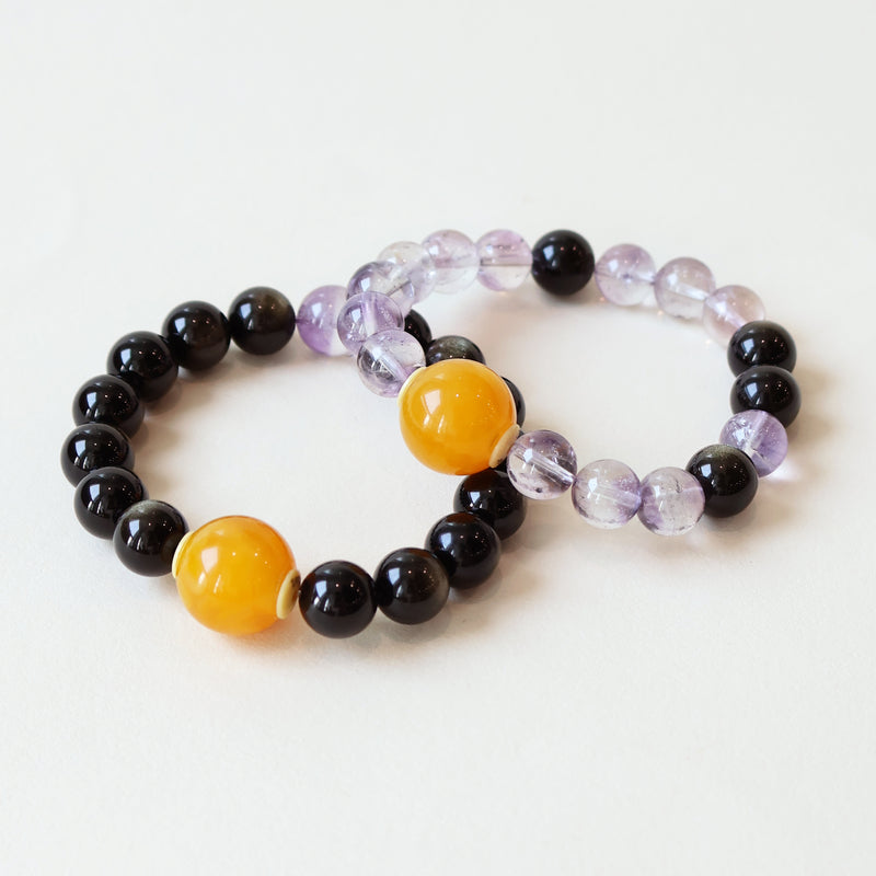 Dusk Whisper couple bracelet set made with natural Gold Obsidian and Purple Rutilated Quartz crystals