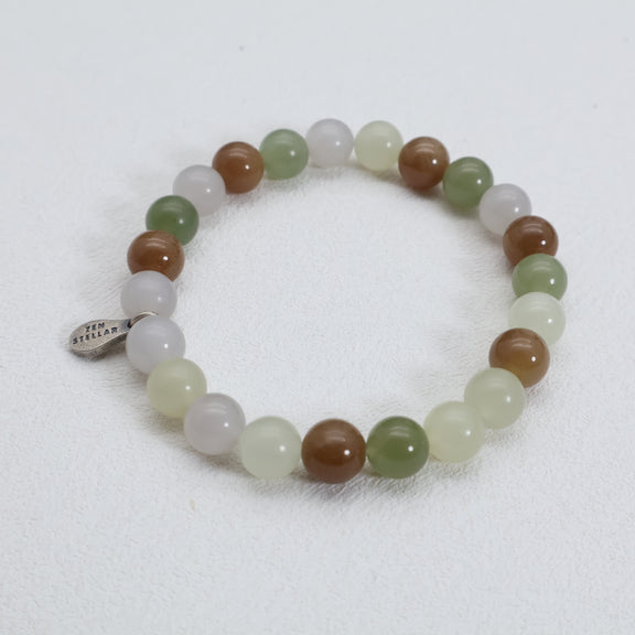 Detail of the 925 sterling silver charm on a multi-tone jade bead bracelet