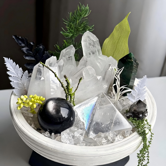 Detailed view of Clear Quartz Clusters, Green Phantom Quartz Tower, Obsidian Sphere, and Smoky Quartz in the Evergreen Sanctuary Crystal Garden