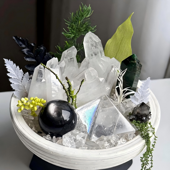Detailed view of Clear Quartz Clusters, Green Phantom Quartz Tower, Obsidian Sphere, and Smoky Quartz in the Evergreen Sanctuary Crystal Garden
