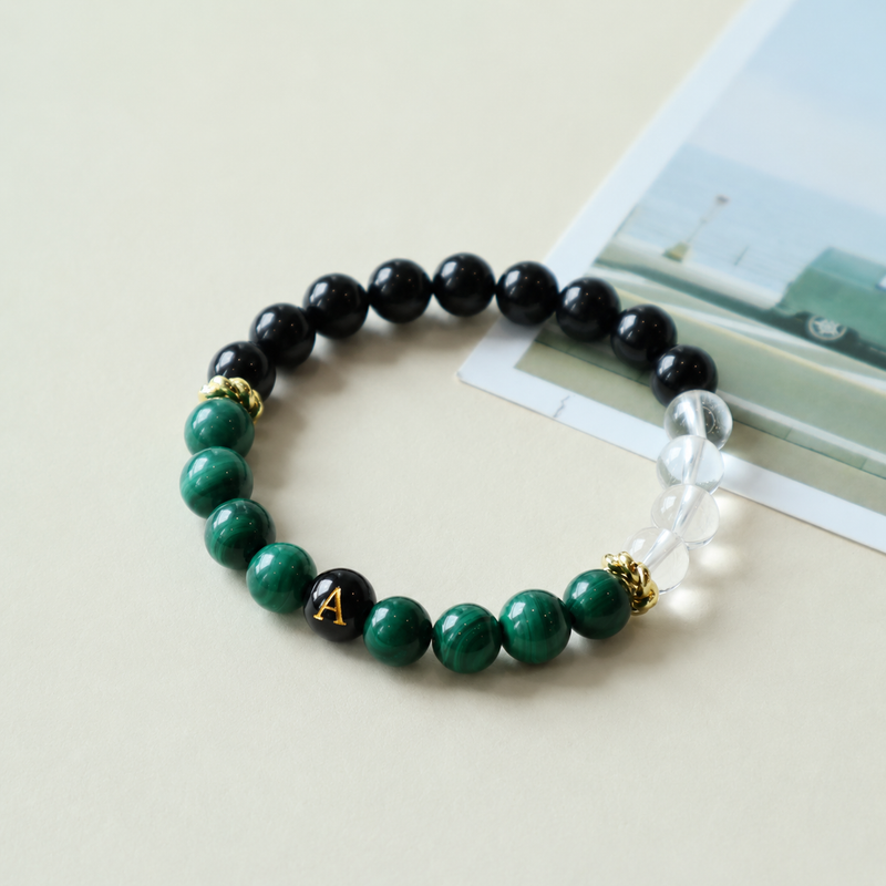 Custom initial gemstone bracelet made with natural Malachite, Black Tourmaline and Clear Quartz for everyday wear.