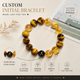 Evermark™ personalized Tiger Eye and Golden Rutilated Quartz bracelet with custom black initial bead