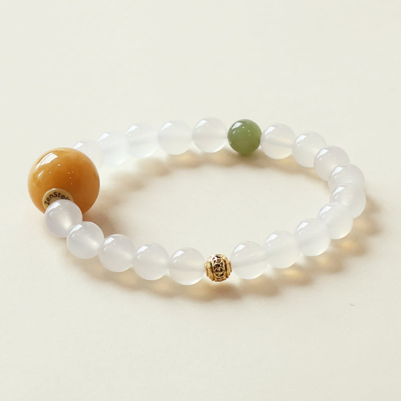 Frost Mist Snow Crystal Bracelet featuring 8mm White Agate beads paired with Hetian Jade accent stone and golden spacer details shown in clean studio lighting