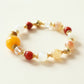 Golden Dawn Radiance Crystal Bracelet featuring rutilated quartz, moonstone, golden tiger eye, clear quartz, and carnelian gemstones