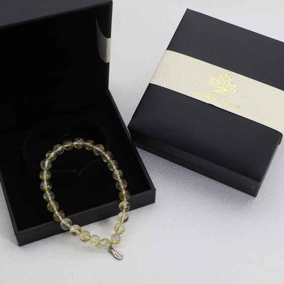 Golden Radiance topaz bracelet displayed in an open black gift box with its matching lid beside it