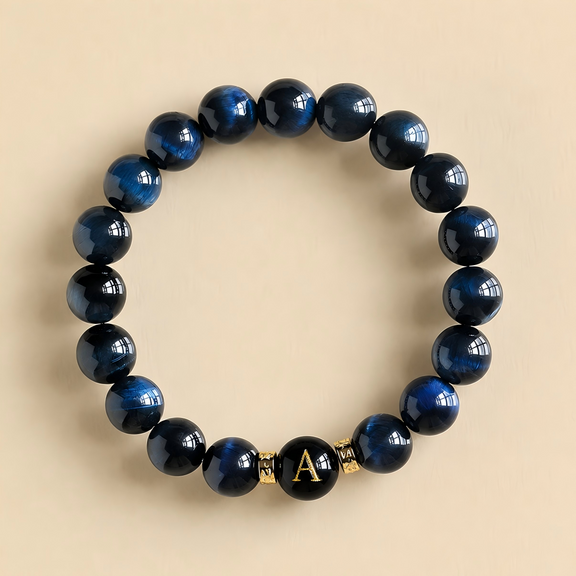 Men's Harmony Link™ personalized Blue Tiger Eye bracelet featuring a custom black initial bead, handcrafted with natural Blue Tiger Eye gemstones.