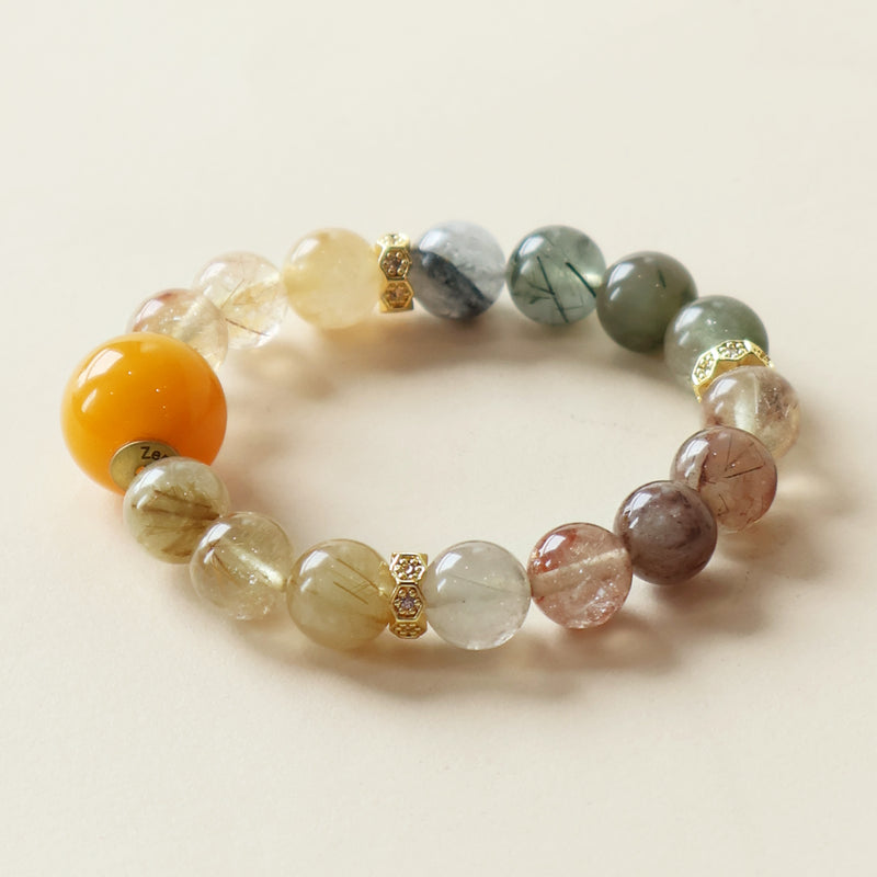 Close-up of a rutilated quartz crystal bracelet featuring 10mm natural gemstone beads with golden thread inclusions, transparent quartz layers, and warm earthy tones, designed as an elegant AI companion bracelet for mindful daily wear.