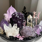Detailed view of natural Uruguayan Amethyst, Brazilian Amethyst, Citrine Tower, Clear Quartz Cluster, Black Tourmaline, and Obsidian in the Nocturne Haven Crystal Garden