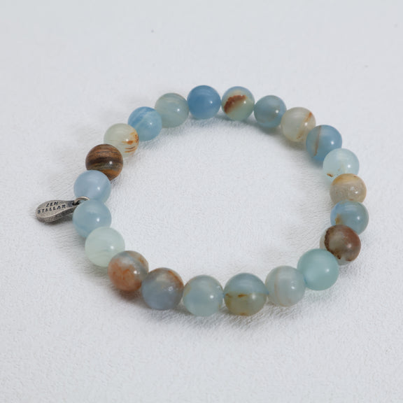 Full view of the Ocean Mist calcite bracelet with natural beads and a 925 sterling silver charm