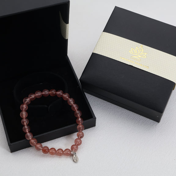 Rosy Spark strawberry quartz bracelet presented in a gift box