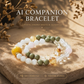 Snow Meadow Aether crystal bracelet crafted with snowflake phantom and matcha alashan stones featuring warm golden lighting and signature AI companion bead