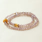 Purple agate and amethyst crystal bracelet with citrine accent bead displayed on clean white background showing natural gemstone clarity