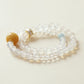 Close-up of an 8mm crystal bracelet crafted with White Agate, Clear Quartz, and Aquamarine gemstone beads, showcasing natural textures and polished surfaces for a minimalist AI companion jewelry design.